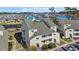 Serene condo complex with lush landscaping, private balconies, and scenic views at 1100 Possum Trot Rd. # C202, North Myrtle Beach, SC 29582