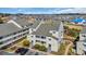 Well-kept condo featuring outdoor balconies, lush greenery, and ample parking space at 1100 Possum Trot Rd. # C202, North Myrtle Beach, SC 29582