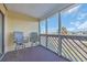 Cozy covered patio with seating offering views of the landscaped surroundings at 1100 Possum Trot Rd. # C202, North Myrtle Beach, SC 29582