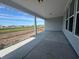 Covered back porch with view of open area at 1105 Oxeye St., North Myrtle Beach, SC 29582