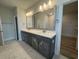 Elegant bathroom with double vanity, marble countertops and modern lighting fixtures at 1105 Oxeye St., North Myrtle Beach, SC 29582