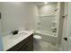 This bathroom features a tub with shower, a stylish vanity and tile flooring at 1105 Oxeye St., North Myrtle Beach, SC 29582