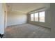 Bright bedroom features plush carpeting, tray ceilings, and large windows overlooking the water at 1105 Oxeye St., North Myrtle Beach, SC 29582