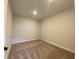 A small, carpeted bedroom with neutral walls and a single recessed light fixture at 1105 Oxeye St., North Myrtle Beach, SC 29582