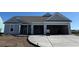 Attractive one-story home with gray siding and spacious two-car garage at 1105 Oxeye St., North Myrtle Beach, SC 29582