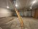 Unfinished garage space with ladder, concrete floor and drywall, ready for customization at 1105 Oxeye St., North Myrtle Beach, SC 29582