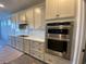 Modern kitchen with stainless steel appliances, quartz countertops, and stylish cabinetry at 1105 Oxeye St., North Myrtle Beach, SC 29582