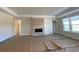 Spacious living room with a fireplace feature, abundant natural light, and modern finishes at 1105 Oxeye St., North Myrtle Beach, SC 29582