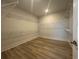 Walk-in closet with built-in shelving and laminate flooring at 1105 Oxeye St., North Myrtle Beach, SC 29582