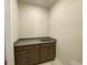 Dry bar with dark wood cabinets, granite countertop, and a stainless steel sink at 1105 Oxeye St., North Myrtle Beach, SC 29582