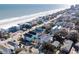 Panoramic aerial view of homes with pools near the beach, highlighting the coastal community at 113-B 10Th Ave. S, Surfside Beach, SC 29575