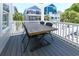 Outdoor table with seating on the balcony perfect for entertaining with a view of the neighborhood at 113-B 10Th Ave. S, Surfside Beach, SC 29575