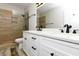 Modern bathroom with a double vanity, white cabinets, stylish fixtures, and a glass-enclosed shower at 113-B 10Th Ave. S, Surfside Beach, SC 29575
