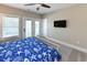 Inviting bedroom featuring a large bed with a blue quilt and balcony access, perfect for relaxation at 113-B 10Th Ave. S, Surfside Beach, SC 29575