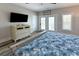 Comfortable bedroom featuring a dresser and access to a private balcony with beautiful views at 113-B 10Th Ave. S, Surfside Beach, SC 29575