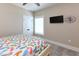 Bedroom with a decorative clock, neutral walls, and a queen size bed at 113-B 10Th Ave. S, Surfside Beach, SC 29575