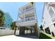 Gorgeous three-story beach house with covered parking and double balconies for stunning views at 113-B 10Th Ave. S, Surfside Beach, SC 29575