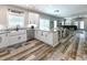 Open-concept kitchen flowing into the living area, complete with granite countertops and stainless appliances at 113-B 10Th Ave. S, Surfside Beach, SC 29575