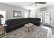 Cozy living room with a large sectional sofa and natural light, perfect for relaxing and socializing at 113-B 10Th Ave. S, Surfside Beach, SC 29575