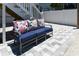 Outdoor patio area with a comfortable lounge seating arrangement and stylish concrete pavers at 113-B 10Th Ave. S, Surfside Beach, SC 29575