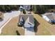 Aerial view of a well-manicured home with an attached two-car garage and an expansive lawn at 1201 Ficus Dr., Myrtle Beach, SC 29579