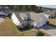 A bird's eye view showcasing the home's curb appeal, with landscaping and a two-car garage at 1201 Ficus Dr., Myrtle Beach, SC 29579
