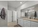 Bright bathroom boasts double sinks and granite countertops with large mirror at 1201 Ficus Dr., Myrtle Beach, SC 29579