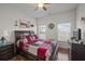 Bedroom featuring a ceiling fan, hardwood floors, and ample natural light at 1201 Ficus Dr., Myrtle Beach, SC 29579