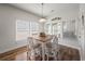 Charming breakfast nook featuring a light wood table, comfortable chairs, and bright windows for cozy dining space at 1201 Ficus Dr., Myrtle Beach, SC 29579