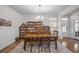 Formal dining room with beautiful wooden table, chairs, chandelier, and shelving to store and display books and decorative items at 1201 Ficus Dr., Myrtle Beach, SC 29579