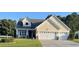 Charming home with a two-car garage, well-kept lawn, and an inviting front porch at 1201 Ficus Dr., Myrtle Beach, SC 29579