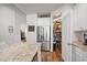 Modern kitchen featuring granite countertops, stainless steel appliances, pantry, and plenty of space for cooking and storage at 1201 Ficus Dr., Myrtle Beach, SC 29579