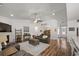 Open-concept living room with hardwood floors, fireplace, and plenty of room to relax and entertain at 1201 Ficus Dr., Myrtle Beach, SC 29579
