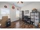 Well-lit office space features a ceiling fan, hardwood floors, and ample natural light at 1201 Ficus Dr., Myrtle Beach, SC 29579