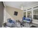Cozy covered patio with comfortable seating, ceiling fan, and view of the backyard, perfect for relaxation at 1201 Ficus Dr., Myrtle Beach, SC 29579