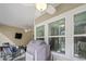 Outdoor patio with grill and furniture, screened in with large sliding doors, bringing outdoor living indoors at 1201 Ficus Dr., Myrtle Beach, SC 29579