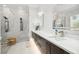 Modern bathroom with a glass enclosed shower, gray cabinets, and quartz countertops at 1217 Bentcreek Ln., Myrtle Beach, SC 29579