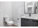 Cozy bathroom featuring a sleek vanity, toilet, and modern mirror, designed for everyday functionality and comfort at 1217 Bentcreek Ln., Myrtle Beach, SC 29579