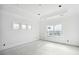 Bright bedroom featuring tray ceilings, recessed lighting, and ample natural light from the windows at 1217 Bentcreek Ln., Myrtle Beach, SC 29579