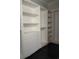 Bright custom closet features shelving and drawers, ready for organization and storage solutions in the primary suite at 1217 Bentcreek Ln., Myrtle Beach, SC 29579