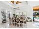 Open concept dining room with bright windows, white trim, and elegant chandelier at 1217 Bentcreek Ln., Myrtle Beach, SC 29579