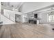 Spacious living room featuring an open floor plan, stairs, and a modern kitchen with a center island, perfect for gatherings at 1217 Bentcreek Ln., Myrtle Beach, SC 29579