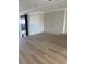 Bright living room featuring fireplace and statement wall, hardwood flooring, and recessed lighting, awaiting personalization at 1217 Bentcreek Ln., Myrtle Beach, SC 29579