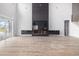 Contemporary living room features a stylish fireplace with built-in cabinets and access to outdoor living at 1217 Bentcreek Ln., Myrtle Beach, SC 29579