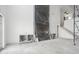 Spacious living room under construction with a fireplace and tall ceilings; covered with protective plastic at 1217 Bentcreek Ln., Myrtle Beach, SC 29579
