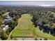 Wide aerial view overlooking a golf course and gorgeous homes in a lush, green neighborhood at 1221 Tidewater Dr. # 1721, North Myrtle Beach, SC 29582