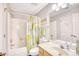 Full bathroom featuring a shower with tub, vanity with a sink, and a decorative mirror at 1221 Tidewater Dr. # 1721, North Myrtle Beach, SC 29582