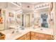Bright bathroom featuring double sinks, decorative mirrors, and ample lighting for a pleasant grooming experience at 1221 Tidewater Dr. # 1721, North Myrtle Beach, SC 29582