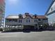 Lovely exterior of a stilted beach house featuring a covered deck and ample parking underneath at 1221 Tidewater Dr. # 1721, North Myrtle Beach, SC 29582