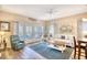 Comfortable living room with a love seat, access to the balcony, and hardwood floors at 1221 Tidewater Dr. # 1721, North Myrtle Beach, SC 29582